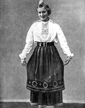 Estonian woman in traditional dress, 1936. Artist: Unknown