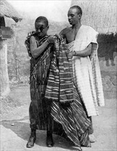 A man and a boy from the Ashanti people, Ghana, Africa, 1936.Artist: LNA Images