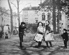 Children skipping in the Grand Place, Bruges, Belgium, 1922.Artist: FC Davis