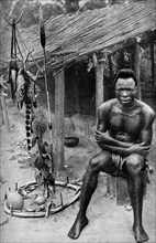 A witch doctor, Belgian Congo (Congo Republic), 1922.Artist: JH Harris
