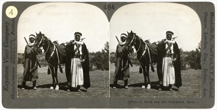 A sheikh and his bodyguard, Syria, 1900s.Artist: Keystone