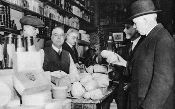 A customer inspects a haggis, London, 1926-1927. Artist: Unknown