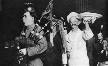 Presentation of the haggis at a Caledonian banquet, London, 1926-1927. Artist: Unknown