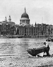 Thames waterman and his boat on the 'beach' at Bankside, London, 1926-1927. Artist: McLeish