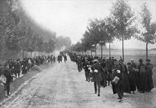 Belgians fleeing from Termonde, First World War, 1914, (1920). Artist: Unknown