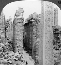 'Middle aisle of the great hall and obelisk of Thutmosis I, temple at Karnak, Thebes, Egypt', 1905.Artist: Underwood & Underwood