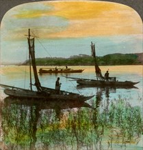 Fishing boats at sunset near Yokohama, Japan, 1904.Artist: Underwood & Underwood