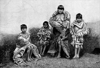 Alakaluf Fuegians, dressed in guanaco skins, Chile, 1895. Artist: Unknown