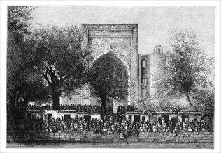 An assembly before the mosque in Bukhara, Uzbekistan, 1895.Artist: Armand Kohl