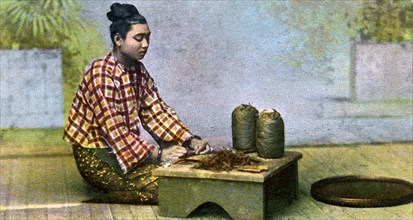 A Burmese woman making cigars, c1900s. Artist: Unknown