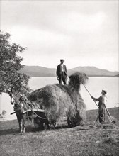 Loading hay onto a wagon on the shores of Loch Lomond, Scotland, 1924-1926.Artist: Donald McLeish
