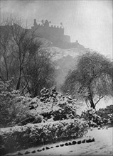 Edinburgh Castle in the snow, from Princes Street Gardens, Scotland, 1924-1926.Artist: W Reid