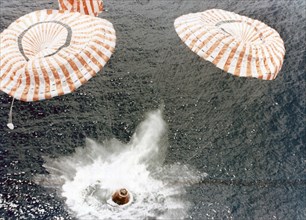 The Apollo 15 capsule lands safely despite a parachute failure, Mid-Pacific Ocean, 1971.Artist: NASA