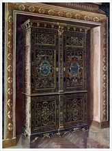 Armoire in ebony with inlays of engraved brass and white metal, 1910.Artist: Edwin Foley