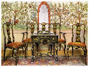 Black lacquer settee, chairs and table and red lacquer mirror, 1910.Artist: Edwin Foley