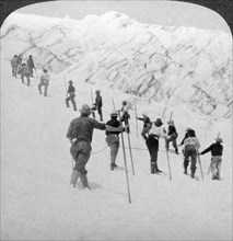 Ascending a steep snowfield, Stevens Glacier, Mount Rainier, Washington, USA.Artist: Underwood & Underwood