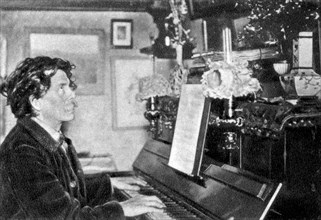 Maurice Rollinat, French poet, playing the piano, 1902. Artist: Unknown