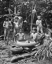 Indians of the Putumayo River with a decapitated head, Amazonia. Artist: Unknown