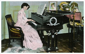 Gertie Millar, British actress and singer, playing the piano, c1890-1909(?). Artist: Unknown