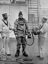 A diver from the battleship HMS 'Camperdown' in his diver's dress, 1896. Artist: Gregory & Co