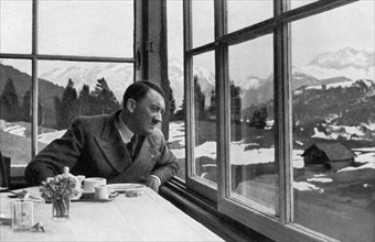 Adolf Hitler admiring the view out a window near Garmisch, Bavaria, Germany, 1936. Artist: Unknown