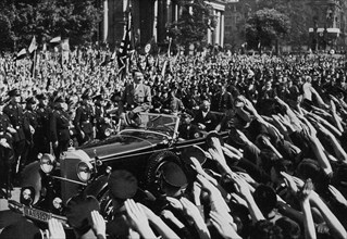 Adolf Hitler departing after making a speech, Berlin, Germany, 1 May 1934. Artist: Unknown