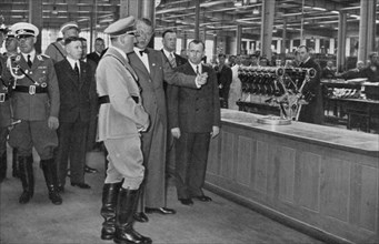 Adolf Hitler visiting a Bavarian engine works, Germany, 1936. Artist: Unknown