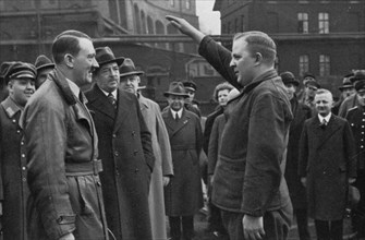 Adolf Hitler saluted by a representative of the staff of a factory, Germany, 1936. Artist: Unknown