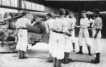 6-inch gun drill, Royal Navy training establishment, Shotley, Suffolk, 1936. Artist: Unknown