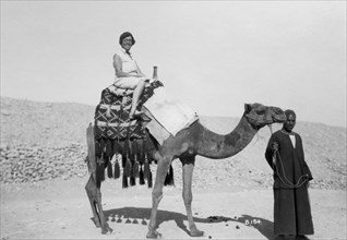 Woman on a camel tour, Egypt, c1920s-c1930s(?). Artist: Unknown