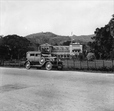 A Singer car in front of the Governor's house, Trinidad, Trinidad and Tobago, 1931 Artist: Unknown