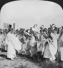 Shinto priests in a funeral procession for 'Hitachi Maru' victims, Tokyo, Japan, 1905. Artist: HC White