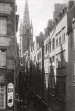 Street scene, showing the cathedral spire, St Malo, Brittany, France, 20th century. Artist: Unknown