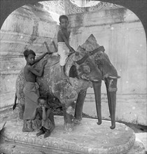 Three headed elephant guarding a sanctuary, Arakan Pagoda, Mandalay, Burma, 1908.  Artist: Stereo Travel Co