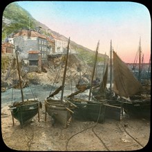 Fishing fleet at low tide, Polperro, Cornwall, late 19th or early 20th century. Artist: Church Army Lantern Department