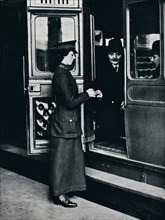 A woman ticket inspector at work, c1914. Artist: Unknown