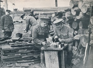 British engineers with the Expeditionary Force making hand grenades out of tobacco tins, c1914. Artist: Unknown