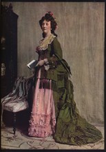 'An afternoon dress of green and pink silk. Very typical of the modes between 1868 and 1878', c1913. Artist: Unknown.