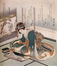 'A woman making a miniature model of Mount Fuji', c1823. Artist: Hokusai.