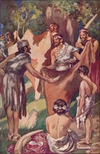 The beginnings of commerce: primitive people bartering ivory tusks and bull hides, 1907. Artist: Unknown.