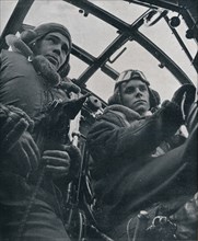 RAF bomber pilot and second pilot, 1941. Artist: Unknown.