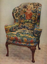 'An upholstered armchair with wings, carved walnut frame and original silk needlework covering', c17 Artist: Unknown.