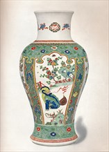 'Famille Verte Vase, with four upright panels painted with rocks and flowering plants, two monsters, Artist: Unknown.
