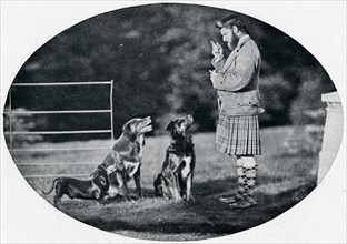 'Mr. Francis Clark, The Queen's Gillie, with three of her favourite dogs', c1899, (1901). Artist: GW Wilson and Company.