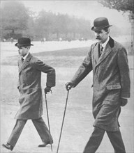 Prince Edward walking with Mr HP Hansell, his tutor, at Auteuil, France, 1912 (1936). Artist: Unknown.