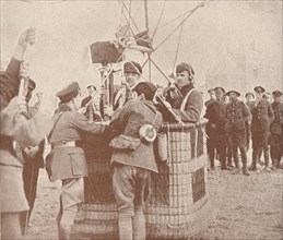Canadian official cinematographer and assistant ready to ascend in a kite balloon, c1917 (1919). Artist: Unknown.