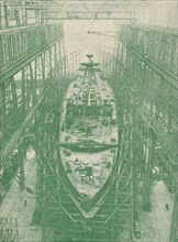 A light cruiser under construction, c1917 (1919). Artist: Unknown.