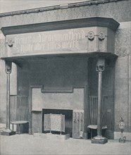 'Fireplace designed by C. Harrison Townsend with carving designed and executed by George Frampton',  Artists: George Frampton, Charles Harrison Townsend.