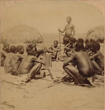 'Braves of a Zulu Village holding a Council, near the Umlaloose River, Zululand, S.A.', 1901. Artist: Unknown.