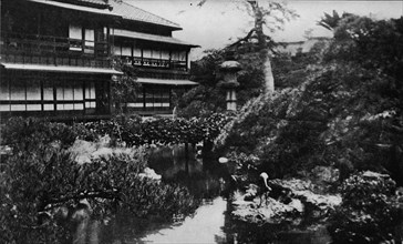 'A tea-house garden, Tokyo. Landscape gardening with theme of volcanic origins', c1900, (1921). Artist: Julian Leonard Street.